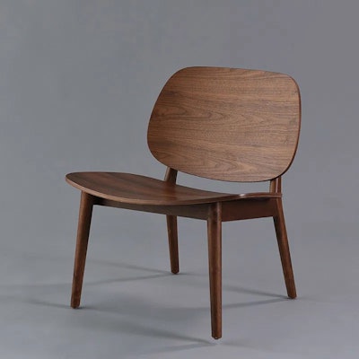 Nuage Designs’ Walnut chair features a natural material in a comforting color that evokes a sense of home.