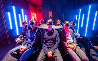 Inside the mirrored-wall exhibit, which was produced by MKG, attendees donned gaming headsets, like those used by the characters in the series, to watch the trailer. The space also featured a wraparound screen and bursts of heat and wind to transport the visitors to the show’s mysterious world.