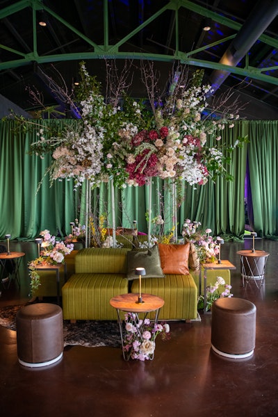 Dot an event space with the movable swivel Marche ottoman with a white gloss metal base and distressed brown vinyl seat from Cort Events.