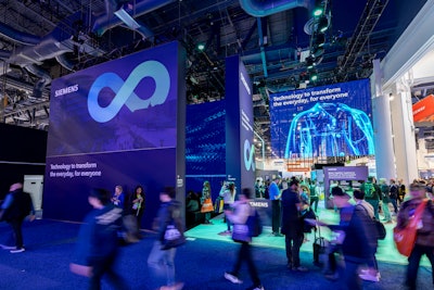 The centerpiece of the exhibit featured a 23-foot-tall immersive theater with 270-degree screens and multidirectional sound, where visitors embarked on a cinematic journey highlighting Siemens' global impact through customer success stories.