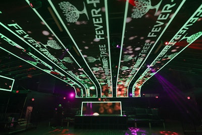 Sponsor names and logos were featured on LED panels overhead. There were a variety of activations throughout the space, including water bottle-engraving from Voss, a luxury photo booth from Flipbook Frenzy, car installations from Lusso Auto Design, and custom cakes from Cinderella Cakes. Sponsors like Bandero Premium Tequila, Ike's Love & Sandwiches, Poppi, ​​GLOW, and Fever-Tree offered F&B throughout the evening.