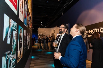 Two friends debate their favorite James Bond at an exclusive party at the International Spy Museum's 'Bond In Motion' exhibit.