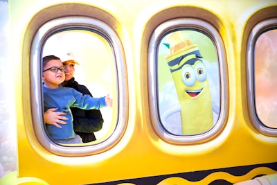 Visitors posed at Dandelion's station, which featured a travel theme.