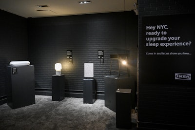 The space features a variety of rooms and vignettes spotlighting IKEA's newest sleep-related products, which include bed textiles, comforter sets, mattresses, and pillows. In one space, the products area placed on museum-like pedestals, and fun facts about sleep are displayed on the walls.