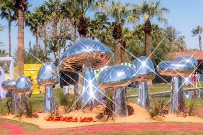 Another out-of-this-world moment at Revolve Festival was a series of large, silver mushrooms that sparkled in the desert sun. The two-day event, which honored Revolve's 'Best Trip' campaign, featured special guests like Ice Spice and 21 Savage. NVE produced the technical and logistical operations as well as the stage design and build, while Blue Revolver crafted the overall festival creative and designed and built the experiential installations.