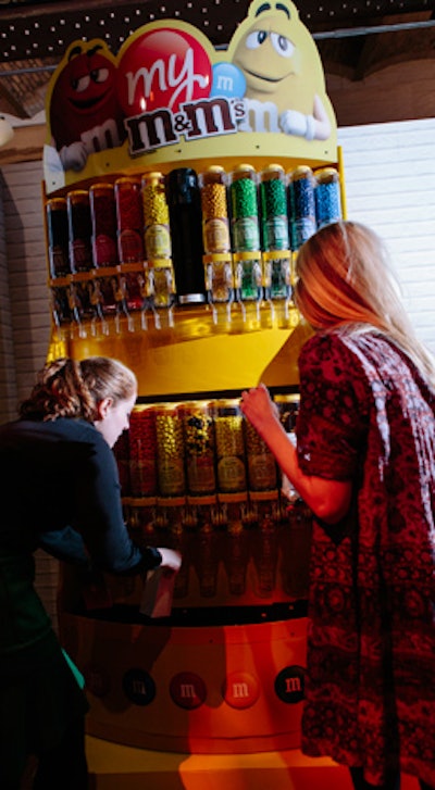 Part of the anniversary campaign asks customers to vote for the next permanent flavor of peanut M&M's. Guests were able to sample the three candidates—honey nut, chili nut, and coffee nut—and numerous colors at a custom candy machine.