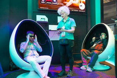 To encourage attendees to explore the entire exhibit, the booth featured a 'Passport Experience.' Visitors scanned their badges at 12 different sections, engaging with various Hisense technologies. Those who completed at least eight check-ins were eligible to win personalized prizes, such as pressed hats and custom soccer or basketball jerseys with their names and numbers.