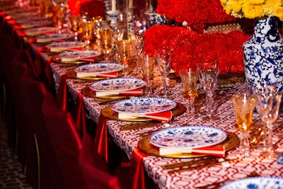 Casa de Perrin provided blue and white china for the dinner, while Chameleon Chair Collection provided seating.