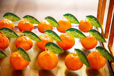 Mandarin oranges included leaves with guest names and seat numbers.