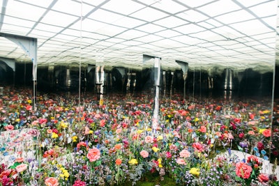 Floral designer Lewis Miller helped create an infinity flower field mirror room inside the space.