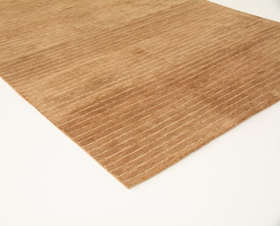 The Foster area rug from Taylor Creative is made from 100% wool in a cappuccino shade. It's available from the New York rental location for events nationwide. Pricing covers a one- to five-day rental period and costs $400 per piece.