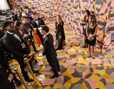 The circular design pattern continued to the event’s press line. Emerging Entertainment handled audio, while Las Vegas-based DJ J. Bray performed. SLAY5 Media provided the photo activations, and there was a lipstick bar from Charlotte Tilbury.