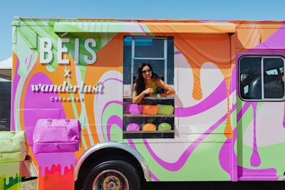 Another eye-catching activation at Revolve Festival came from Shay Mitchell's travel accessories brand, BÉIS. In honor of its new Sherbet Collection, the brand teamed up with Wanderlust Creamery to serve limited-edition ice cream out of a colorful on-site ice cream truck. In a fun touch, products from The Sherbet Collection were displayed on the side of the truck. The activation was produced by Food Truck Promotions.