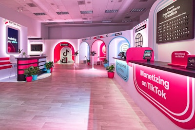 The lounge also featured meeting pods, an arrivals-inspired content creation moment, refreshments, and games.