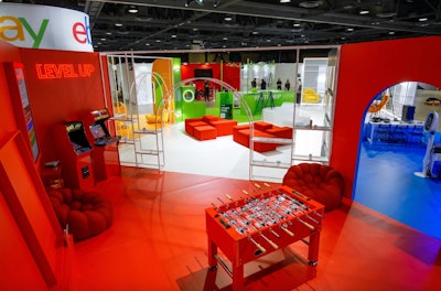 The house-centric theme evoked how both buyers and sellers engage with eBay at home. The red game room space, for example, focused on the brand’s collectibles market and featured vintage stand-up arcade games like Ms. Pac-Man and NBA Jam. (In a clever, on-theme twist, the foosball table had collectible cards in the place of players.) A yellow office, meanwhile, was focused on luxury items that can be found on eBay. The team created various LED backlit arch photo moments, plus a custom display case with tubes where fans could visualize luxury watches on their own wrists. Media.Monks was the creative agency behind the booth, while Stoelt Productions handled production. See more: See Inside eBay's Massive Five-Room 'House' at ComplexCon