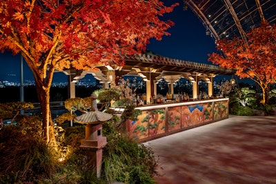 Each pagoda featured intricate paintings re-created from show files. 'Seeing them lit was a showstopper,' said Schubert. In another on-theme touch, an on-site calligrapher painted guests' names on bookmarks in Japanese writing.