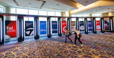 For one hallway outside of the ballrooms, VDA built this 60-foot-long structure filled with customer testimonial banners. 'This was one way we made sure that there was a connectedness,' Breen says.